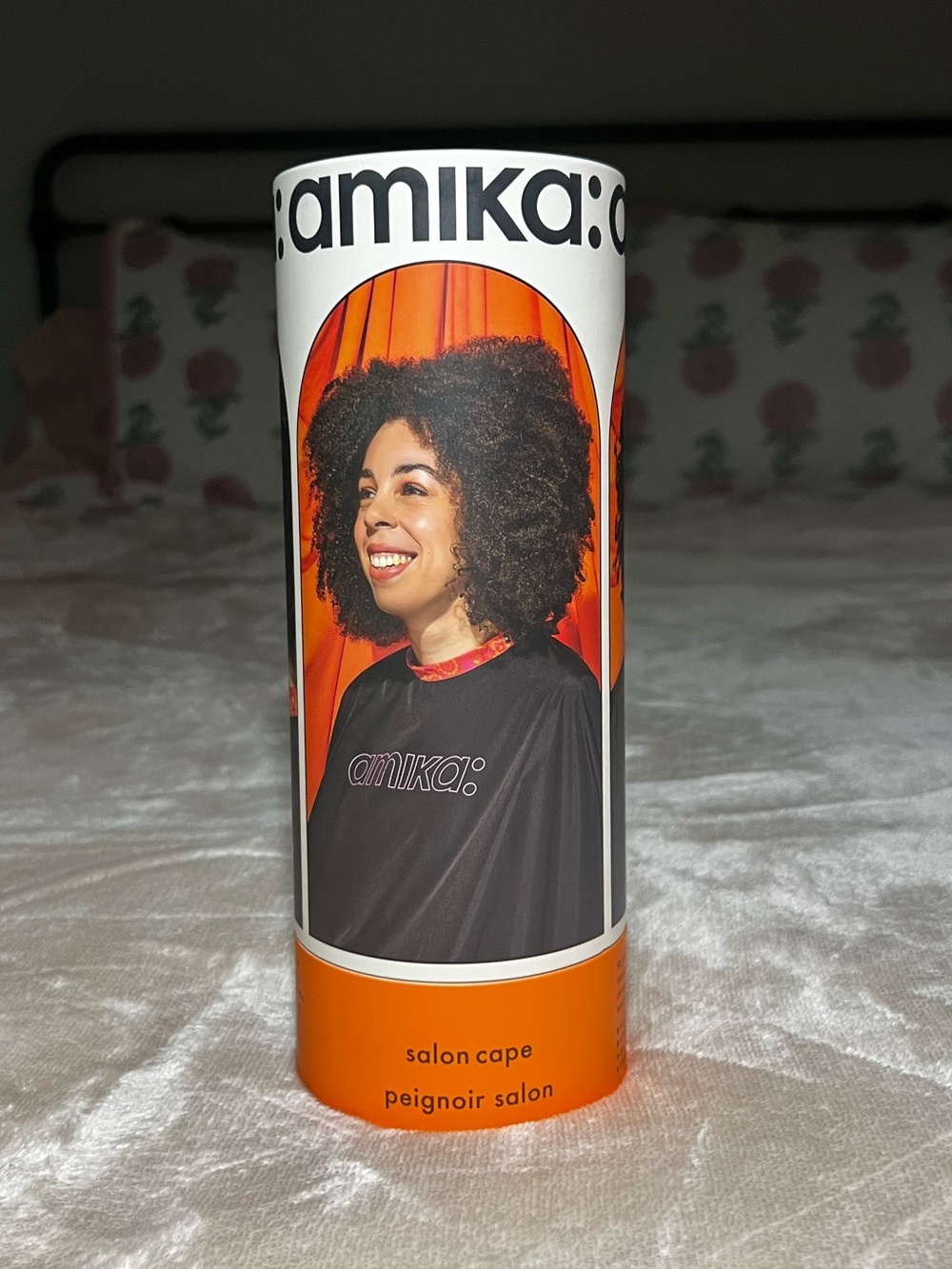 amika: Pro Salon Cape in Black with Orange Trim